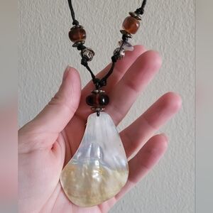 Boutique shell pendant and amber beaded necklace